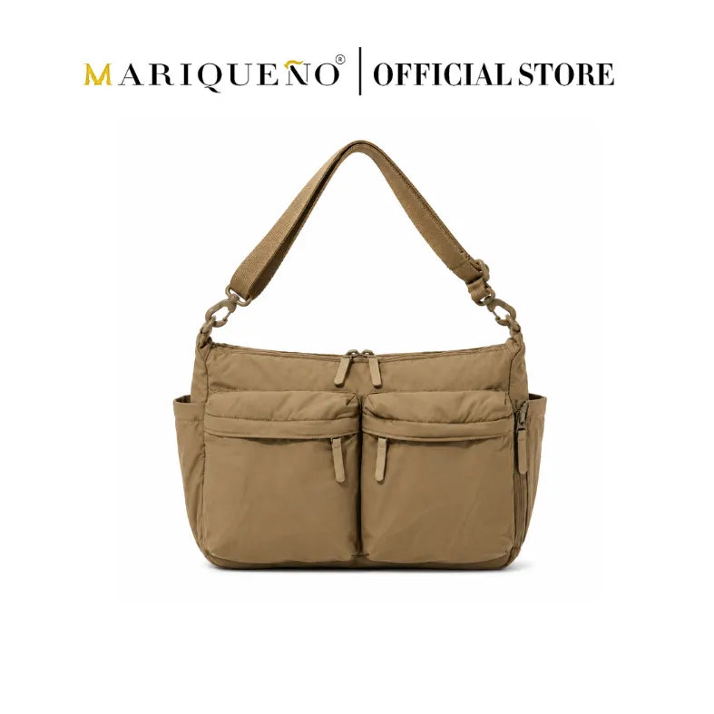 Tan handbag with multiple pockets on a white background, featuring the Mariqueno brand.
#color_khaki