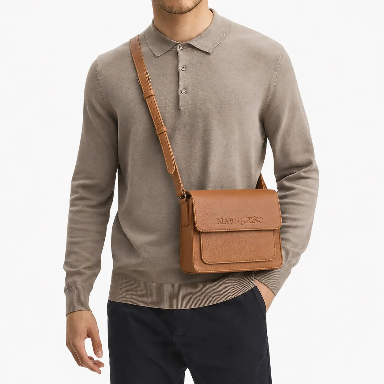 Man wearing a tan brown leather top handle bag with 'MARIQUENO' branding on a light background
#color_tan