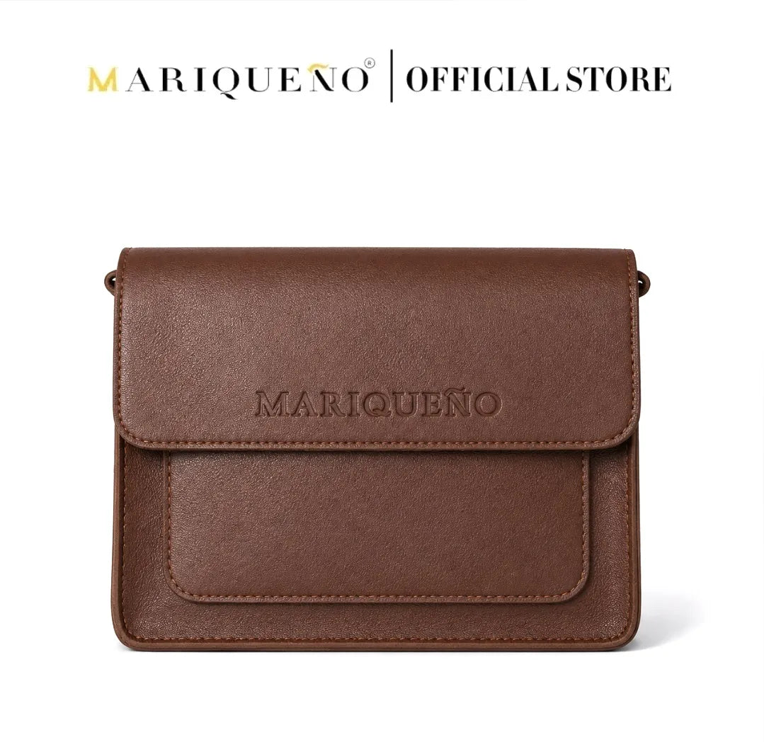 Walnut brown leather clutch bag with 'Mariqueno' branding on a white background
#color_walnut