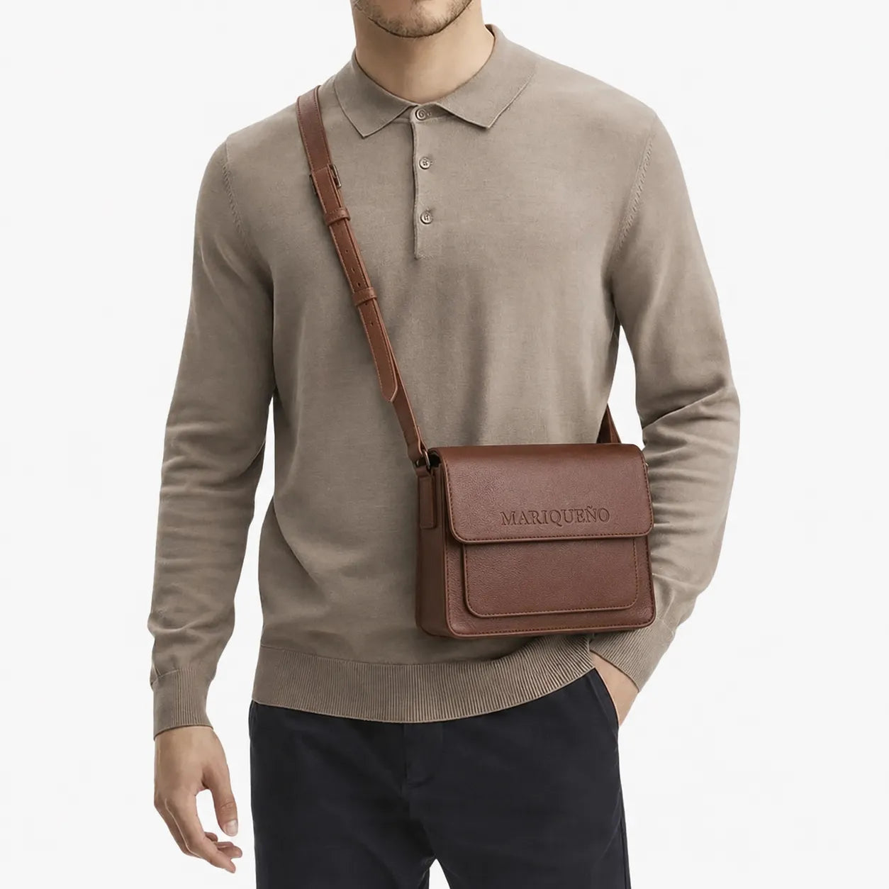 Man wearing a brown sweater with a walnut brown mariqueno top handle bag on a white background
#color_walnut
