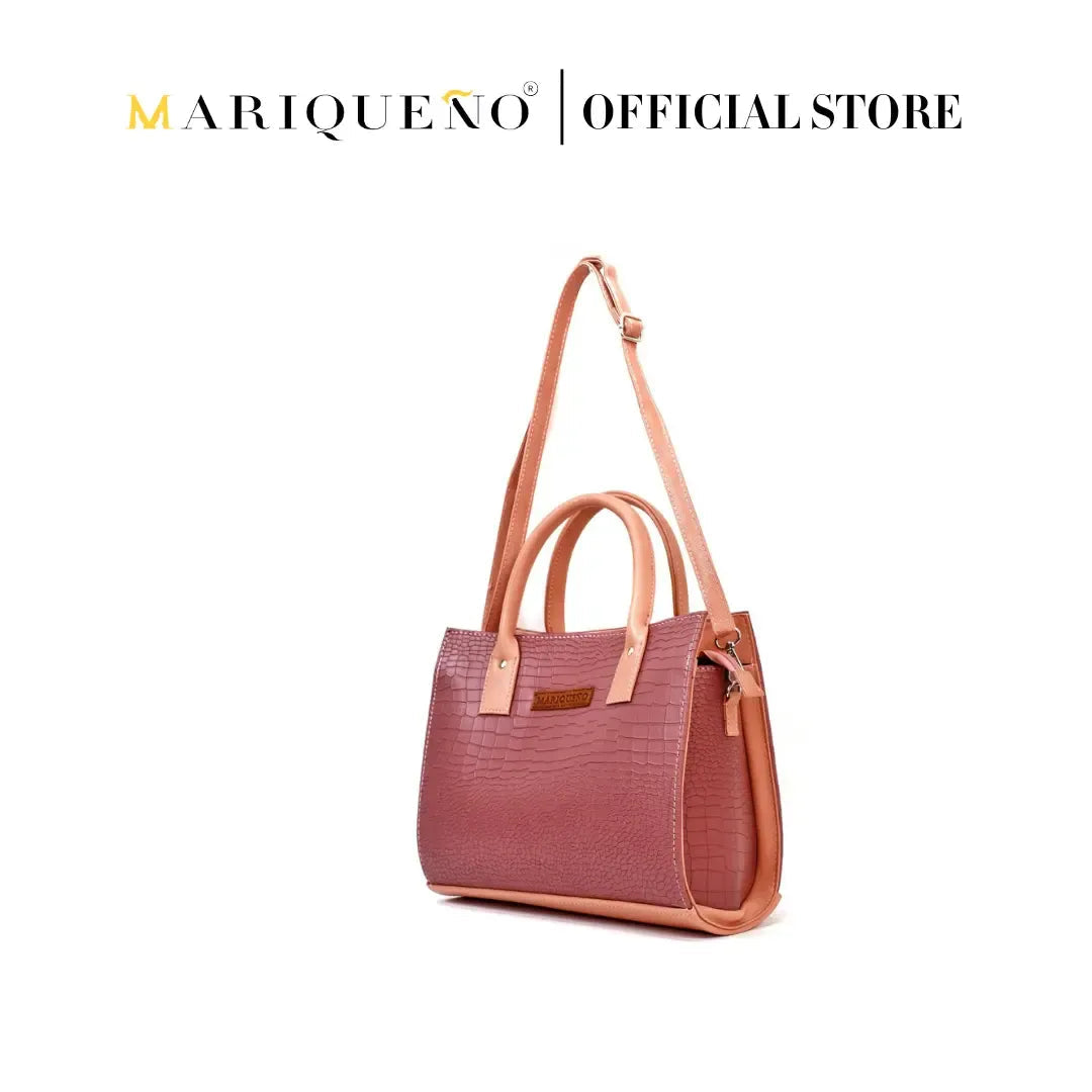Marqueano handbag with pink body and brown handles and strap on a white background
#color_old rose