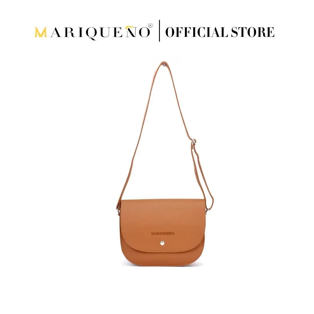 Brown shoulder bag with 'Mariqueno' branding on a white background
#color_tan brown