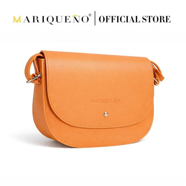 Brown leather crossbody bag with 'Marqueéno' branding on a white background
#color_tan brown