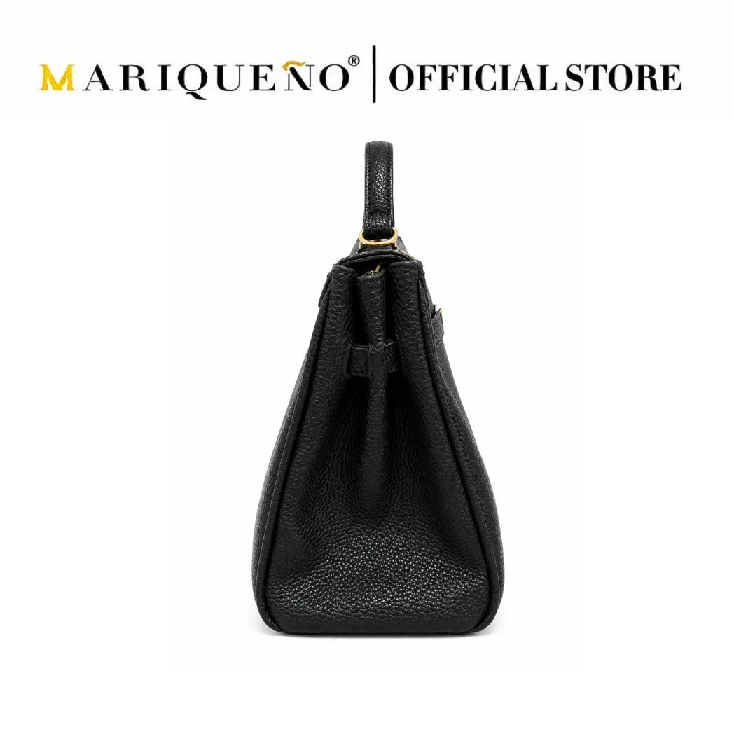 A black pebbled leather handbag shown from the back, featuring a top handle and a small strap detail, set against a plain white background with 'MARIQUENO | OFFICIAL STORE' text at the top.
#color_black