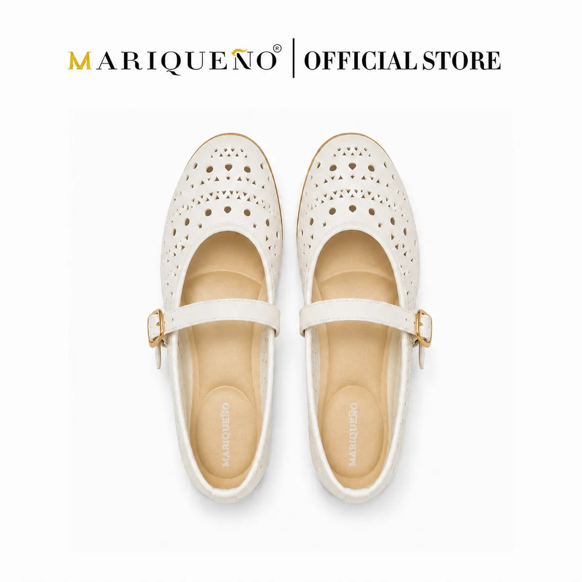 A pair of off-white Mary Jane shoes with perforated detailing on the toe and a gold buckle strap, shown from a top-down view on a white background with 'MARIQUENO | OFFICIAL STORE' text at the top.
#color_white