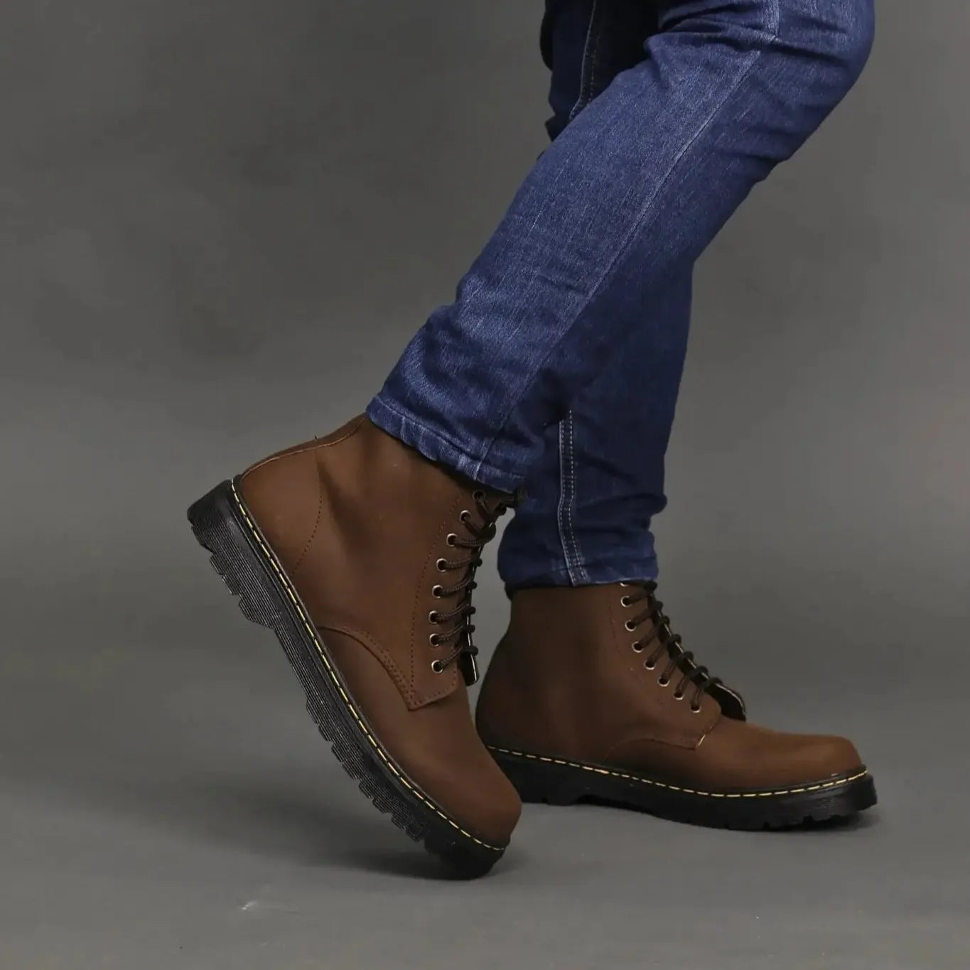 Model wearing a pair of brown matted high cut boots
#color_malt brown