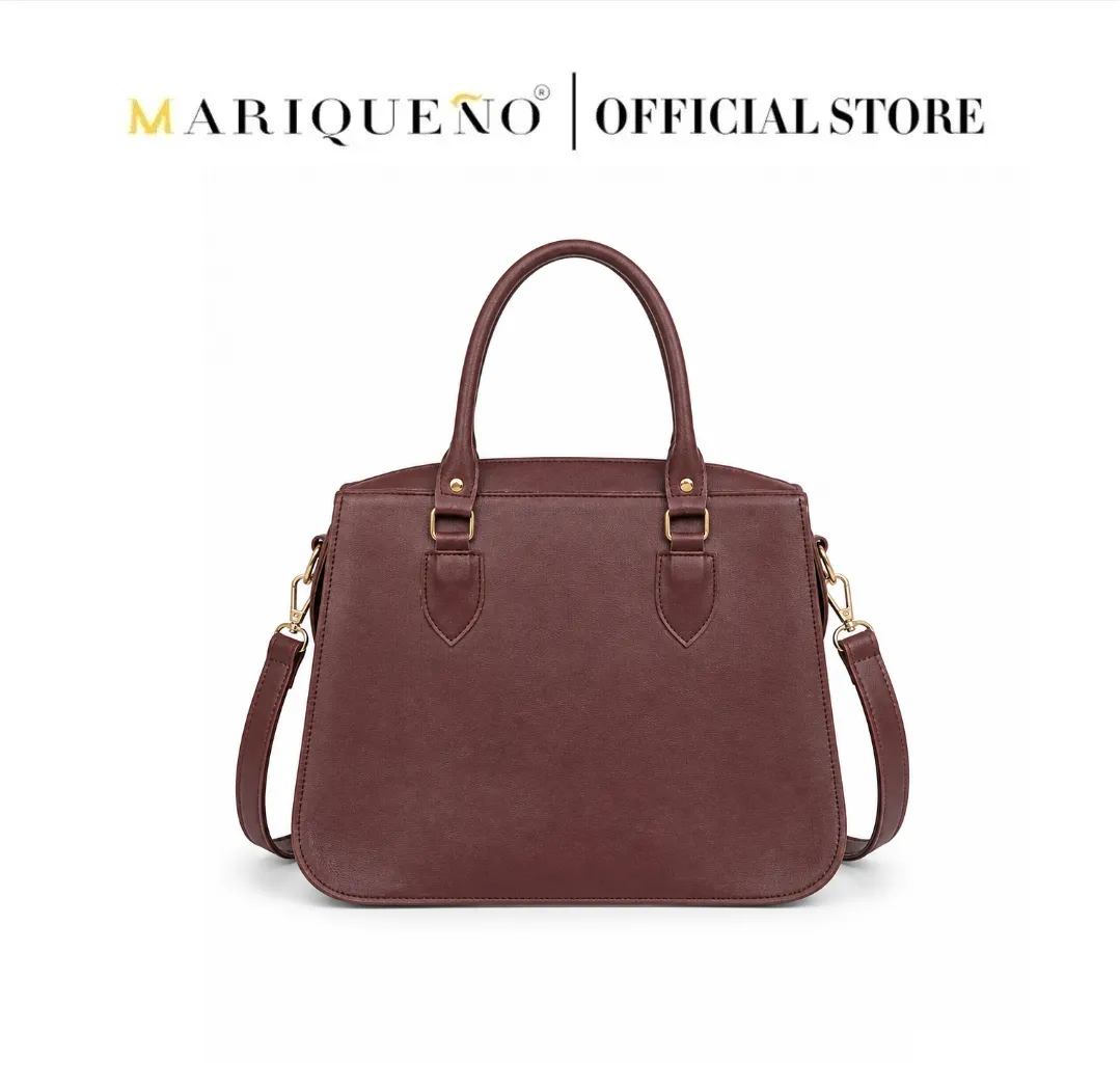 Brown handbag with gold accents on a white background, featuring the Mariqueño logo.
#color_choco brown