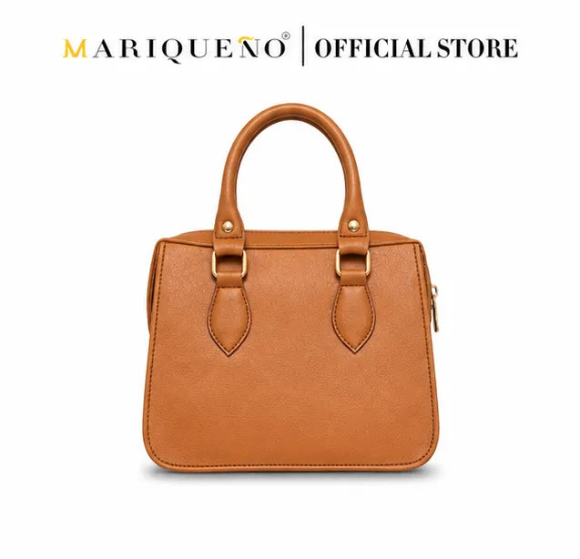 Brown handbag with gold accents on a white background, featuring the Marqueno logo.
#color_tan