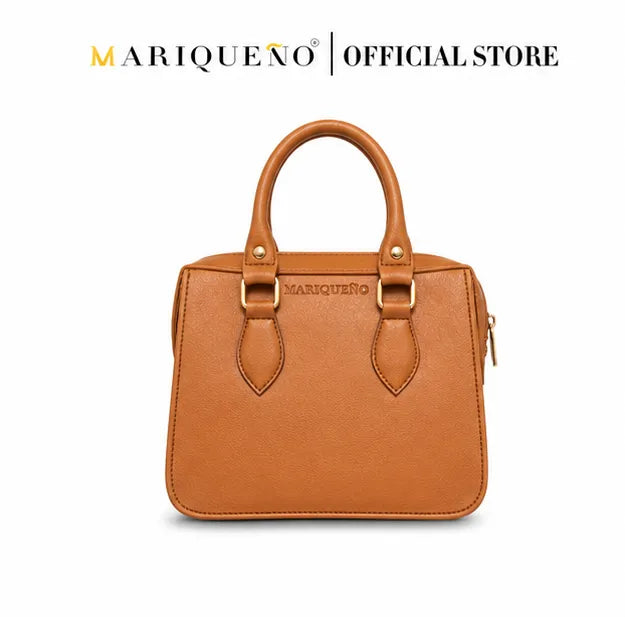 Brown handbag with gold accents on a white background, featuring the Mariqueo brand.
#color_tan
