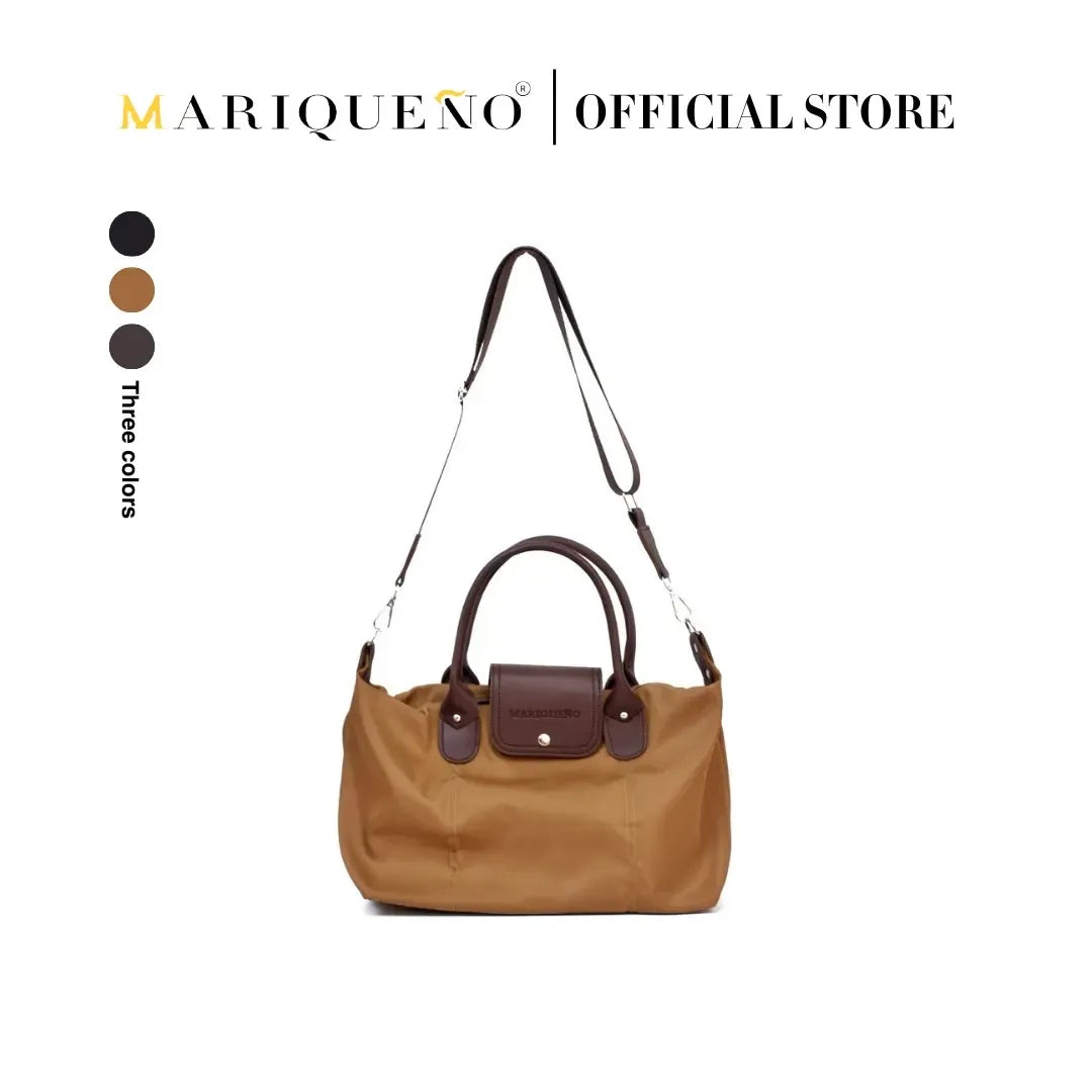 Brown handbag with brown handles and strap on a white background, featuring the Mariqueño brand.
#color_coffee brown