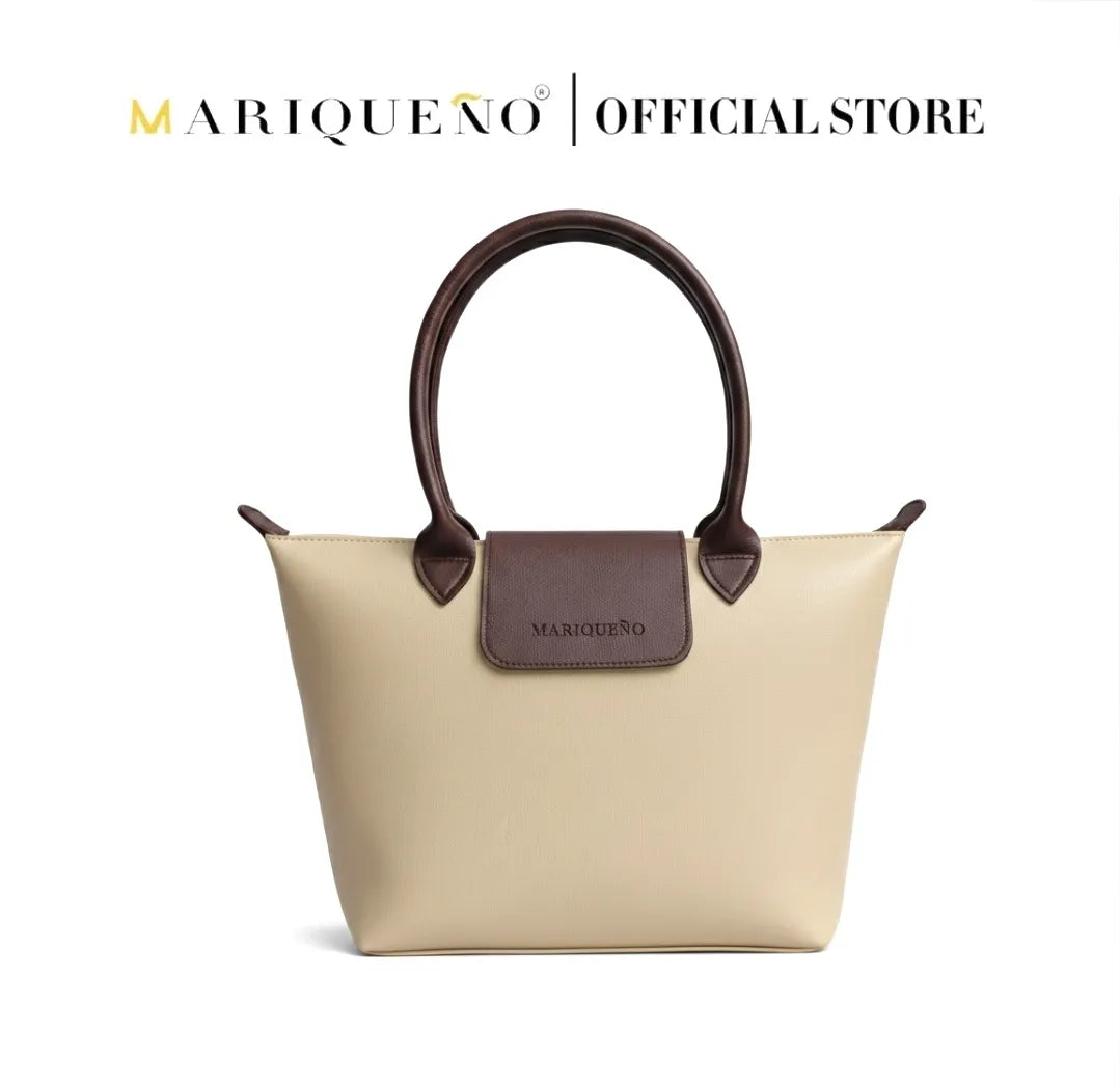 Cream handbag with brown handles and accents, featuring Marqueéno branding on a white background.
#color_cream