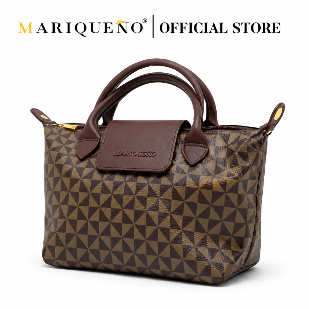 Brown patterned handbag with brown handle and accents, featuring 'Mariquero' branding on a white background.
#color_choco brown geo