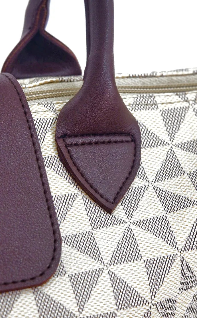 Close-up of a purple leather handle on a patterned bag
#color_sandstone geo