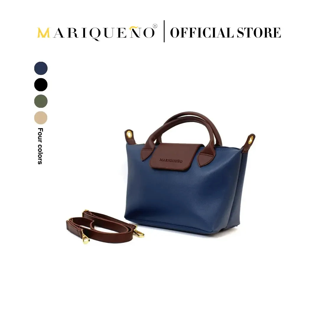 Blue handbag with brown accents and strap, featuring Mariqueno branding on a white background.
#color_blue