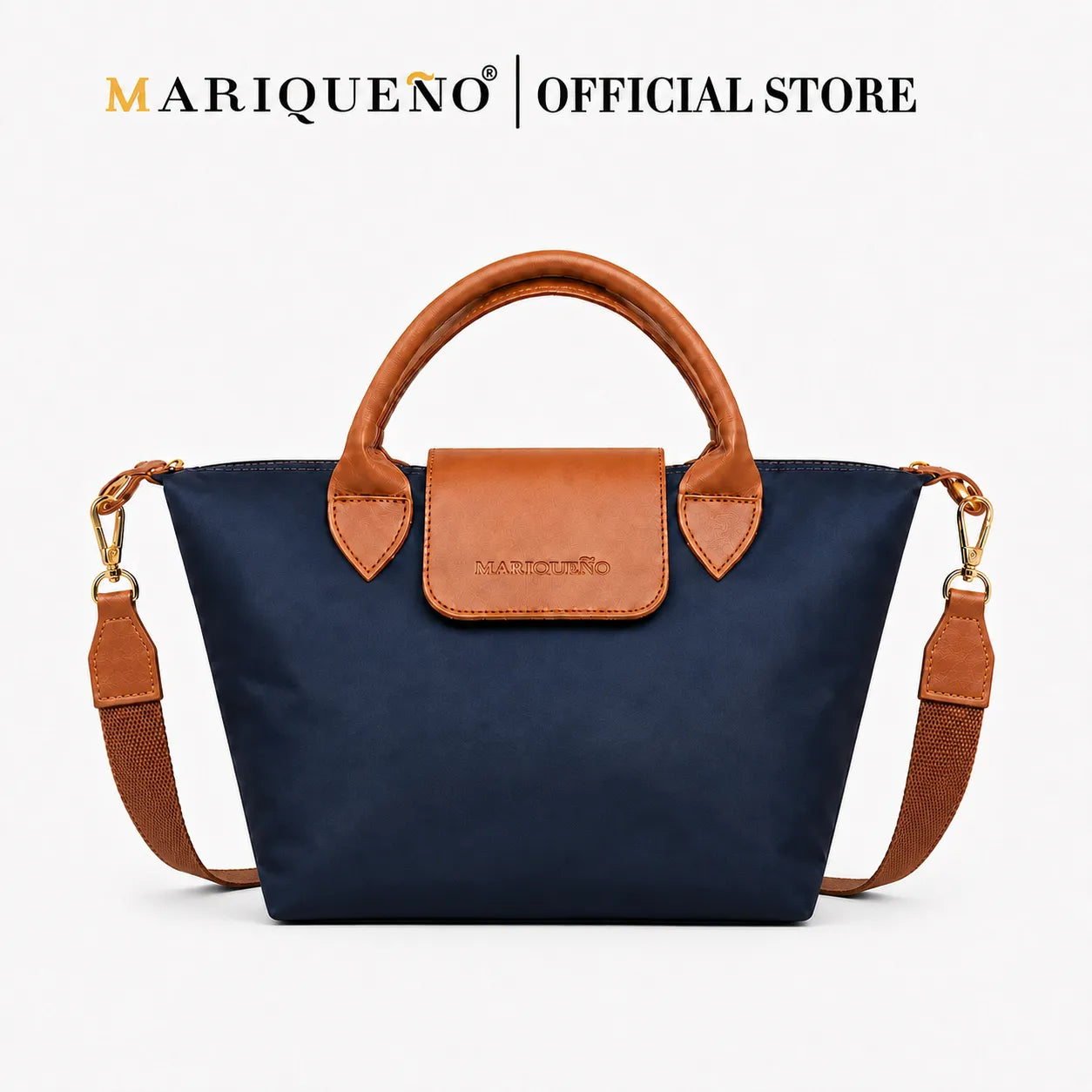 A navy blue nylon tote bag with tan leather handles, trim, and a matching front flap, shown on a clean white background. The Mariqueno brand name is displayed at the top of the image.
#color_navy blue