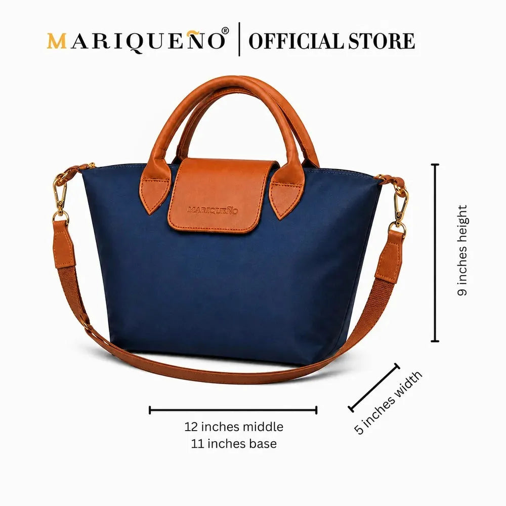 A navy blue and brown handbag with a shoulder strap, shown on a white background with dimension lines and text indicating height, width, and middle depth. The Mariqueno brand name is visible at the top and embossed on the front flap.
#color_navy blue