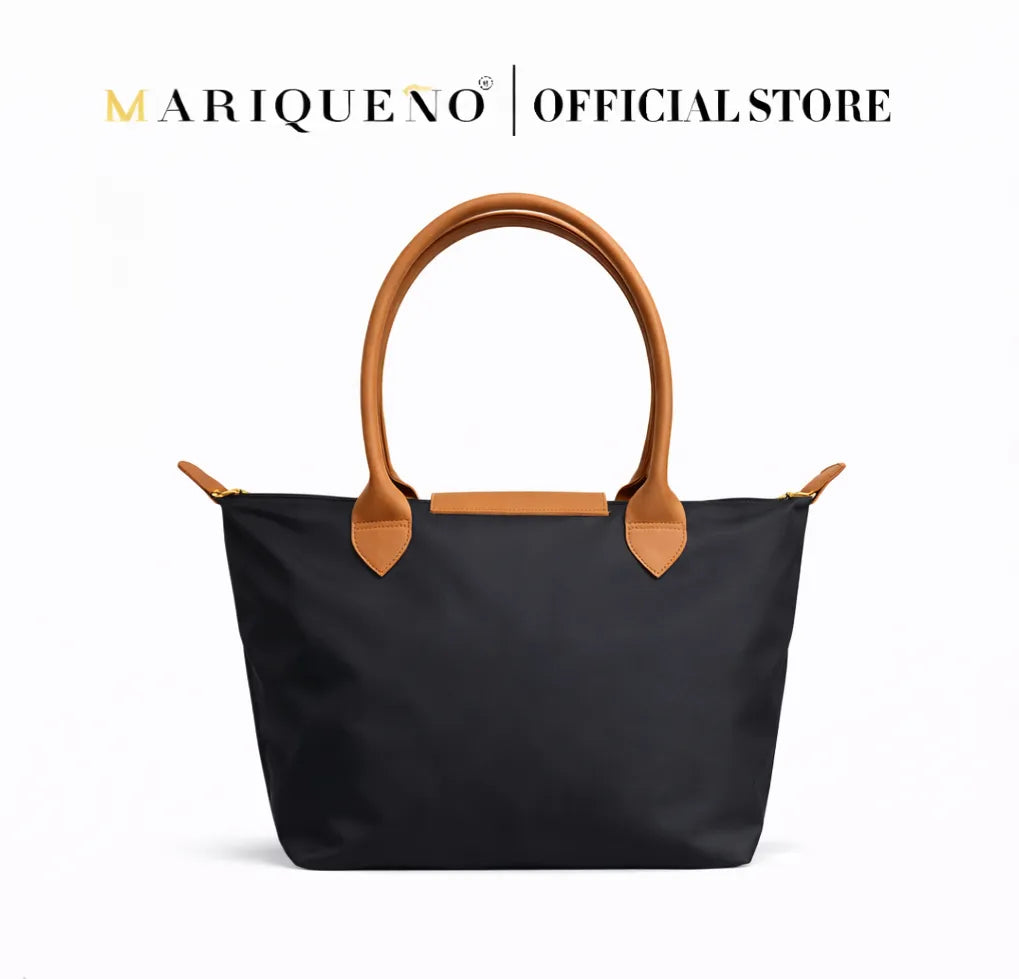 Black tote bag with brown handles and accents on a white background, featuring the Marqueno logo.
#color_black