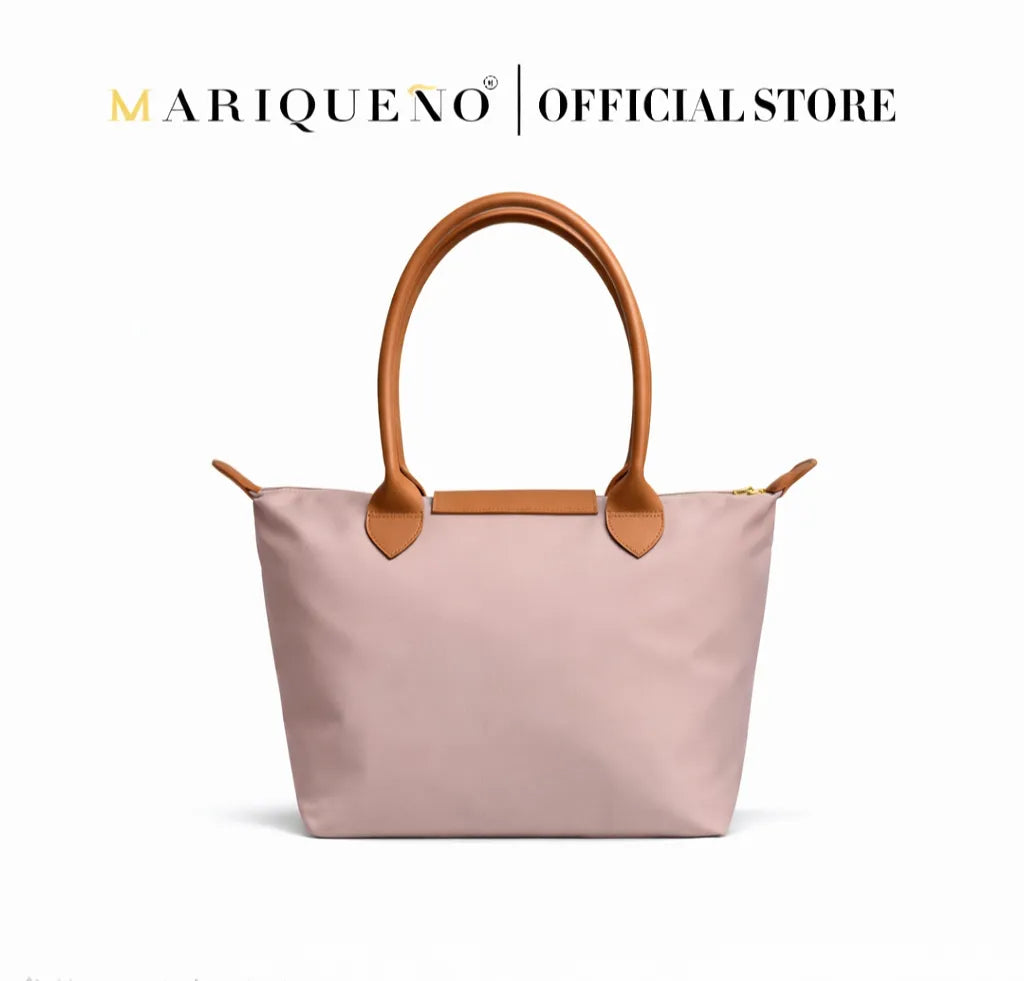 Taupe handbag with brown handles and accents on a white background, featuring the Mariqueno brand.
#color_taupe
