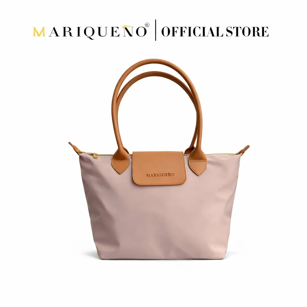 Taupe handbag with brown handles and accents on a white background, featuring the Mariqueno brand.
#color_taupe