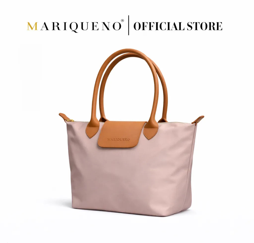Taupe handbag with brown handles and accents on a white background, featuring the Mariqueno logo.
#color_taupe