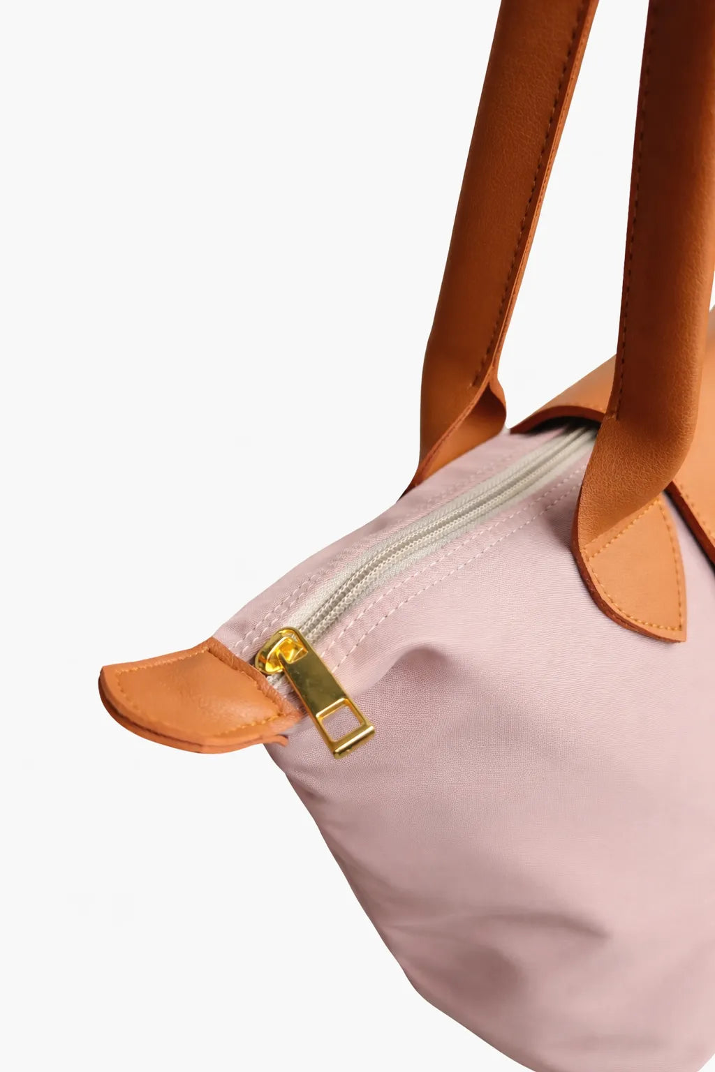 Close-up of a taupe bag with orange handles and zipper on a white background
#color_taupe