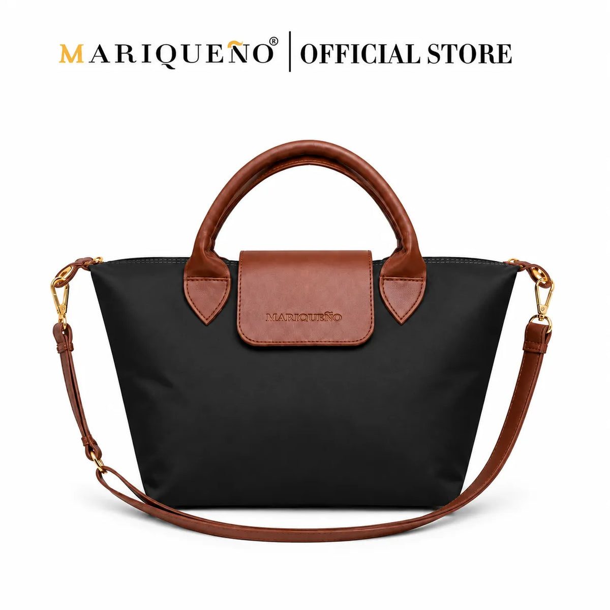 A black nylon tote bag with brown leather handles, a brown leather front flap, and gold-tone hardware, shown on a white background with the text 'MARIQUEÑO | OFFICIAL STORE' at the top.
#color_black and choco