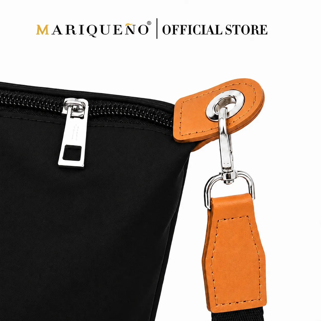 Black bag with orange strap and zipper, featuring Mariqueno logo.
#color_black and tan