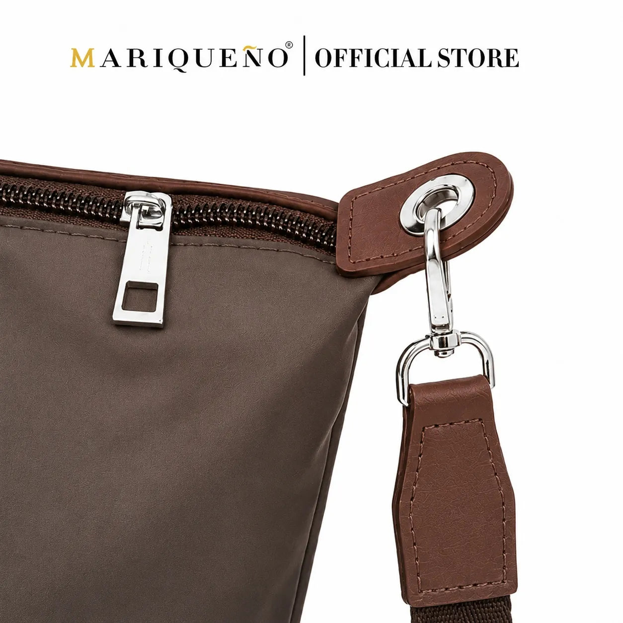 Brown bag with silver zipper and clasp on a white background, featuring Mariqueno branding.
#color_choco brown