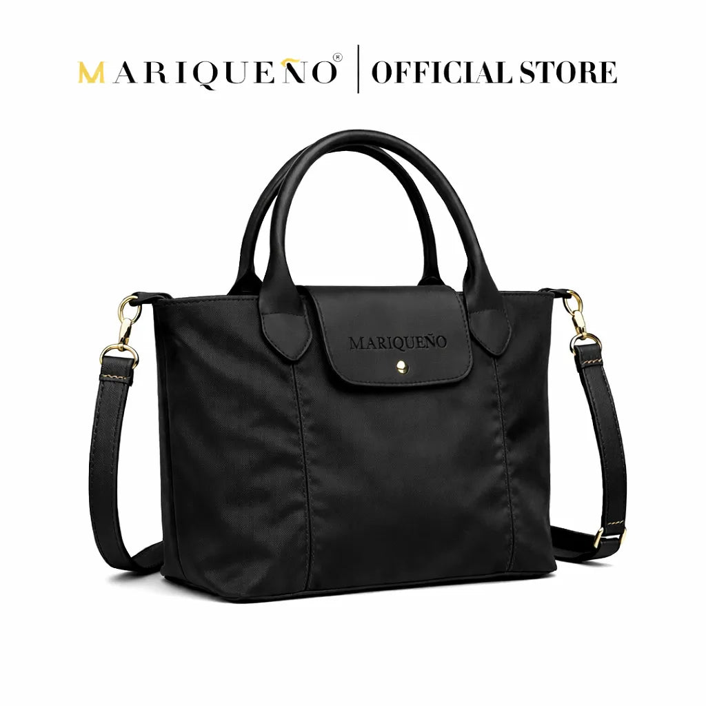 Black handbag with shoulder strap on a white background, featuring the Mariqueéno brand.
#color_black