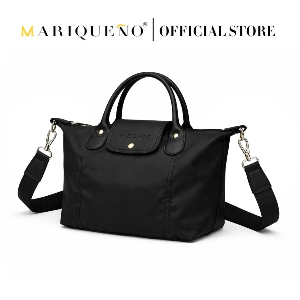 Black handbag with gold accents on a white background, featuring the Mariqueno brand.
#color_black