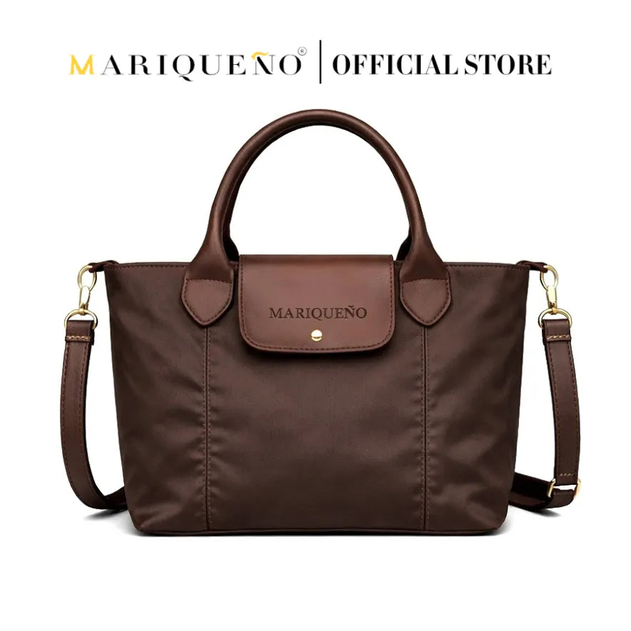 Brown handbag with a visible brand logo on a white background, featuring color options.
#color_choco brown