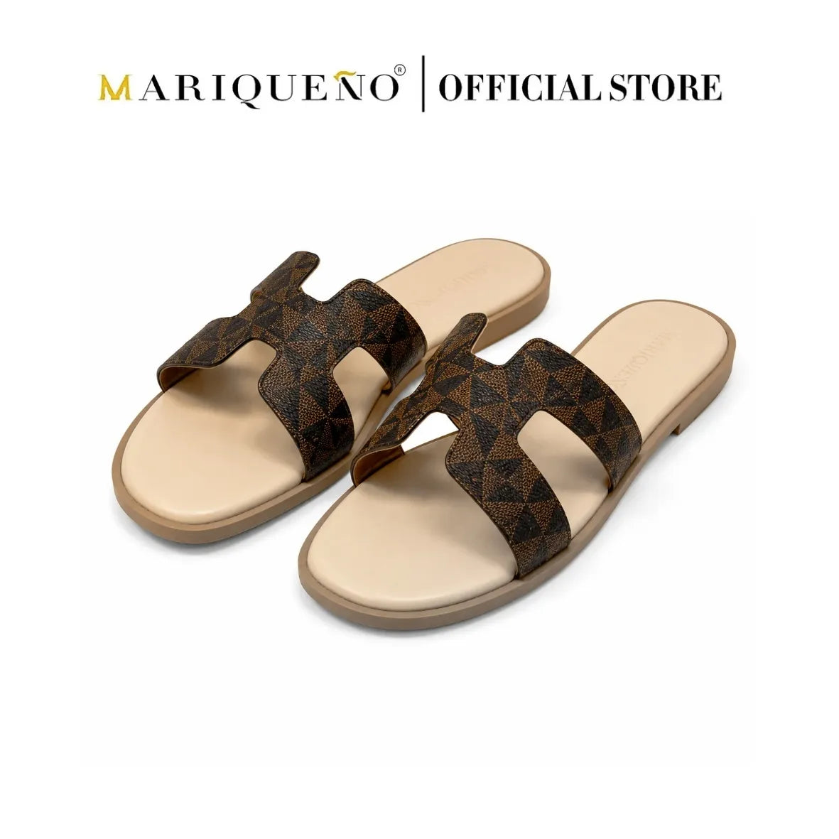 A pair of women's slide sandals with a dark brown and black geometric patterned strap and a beige footbed, shown on a white background with 'MARIQUENO | OFFICIAL STORE' text at the top.
#color_mocha brown geo