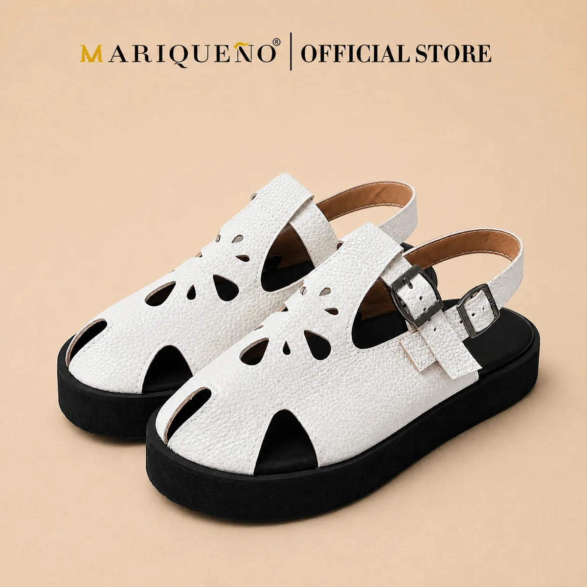 A pair of white textured leather slingback sandals with black soles and cutout details on the toe and sides, shown against a plain white background with 'MARIQUENO | OFFICIAL STORE' text at the top.
#color_white