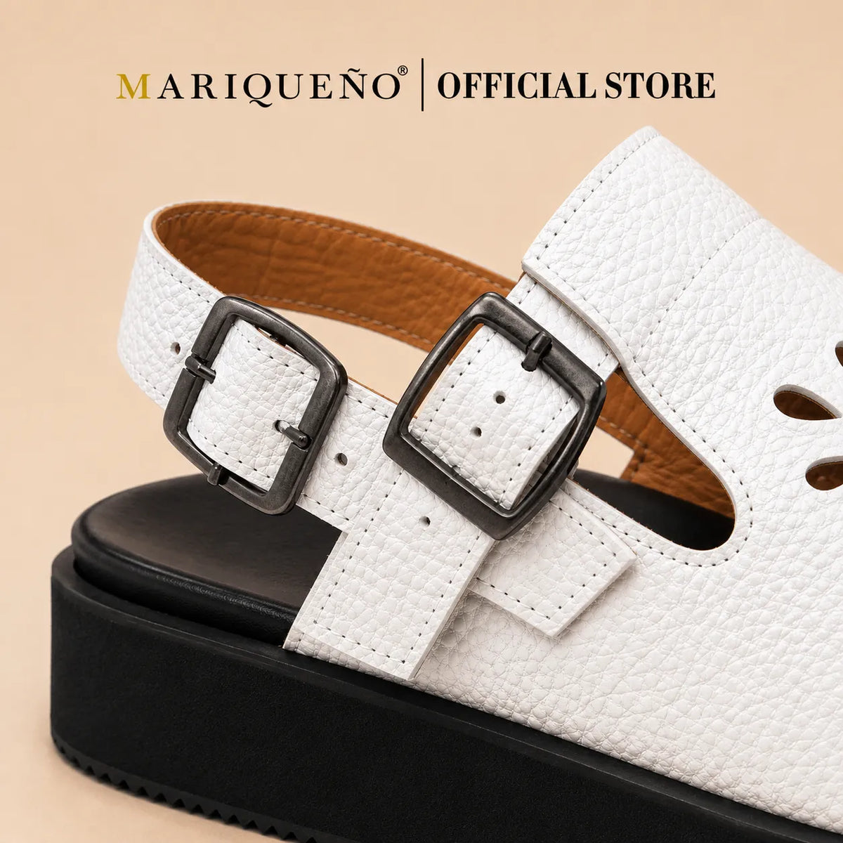 Close-up of a white pebbled leather mule sandal with two dark metal buckles, a black platform sole, and a tan interior lining.
#color_white