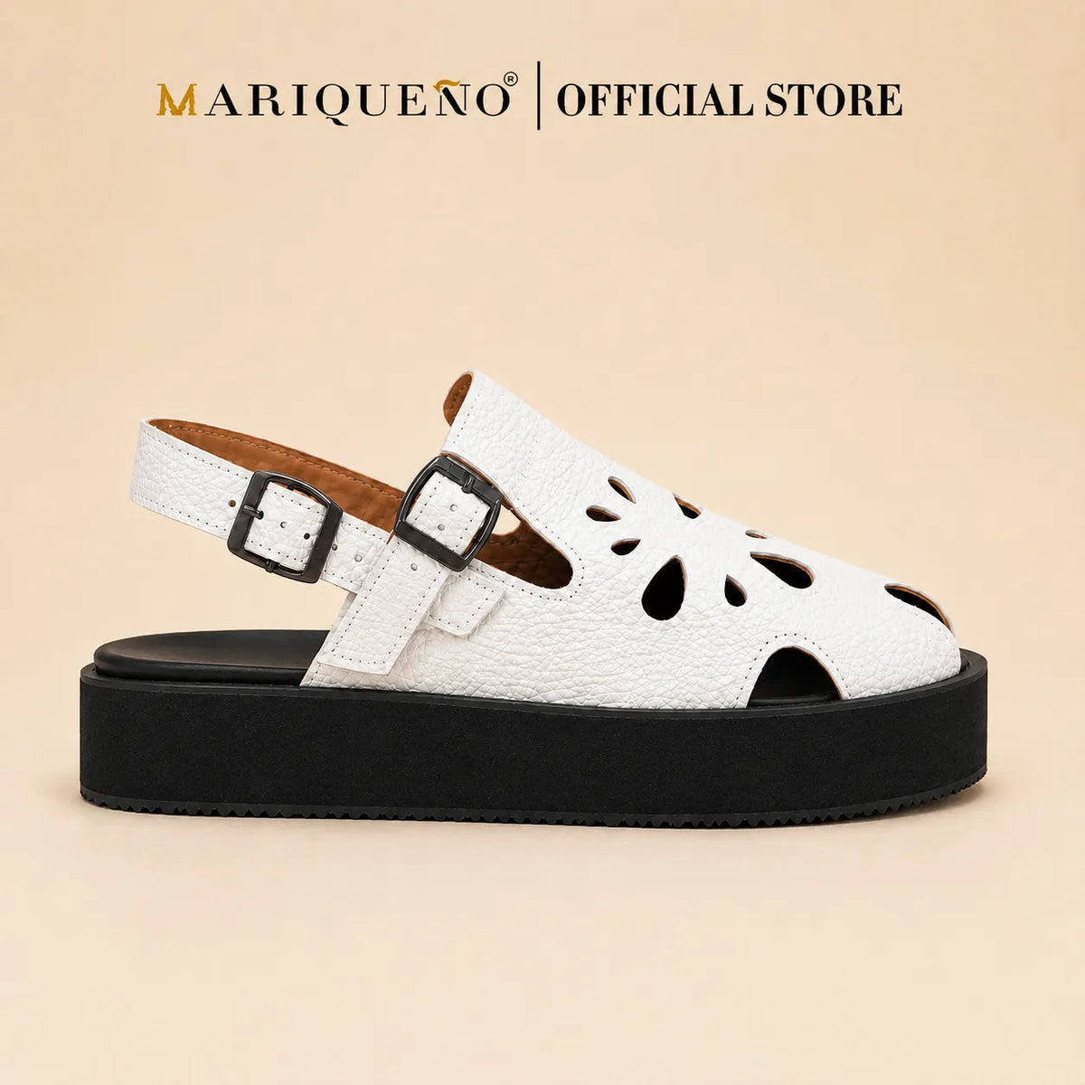 A single white textured faux-leather sandal with cutout details on the toe and heel, featuring dual buckle straps and a chunky black platform sole, shown against a plain white background with 'MARIQUENO | OFFICIALSTORE' text at the top.
#color_white