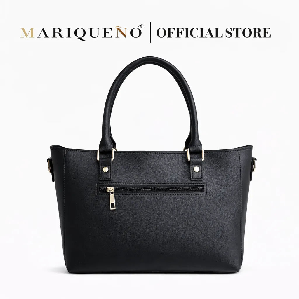 Black handbag with gold zippers on a white background, featuring the Mariqueño brand.
#color_black