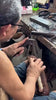 A Marikina shoe maker in action