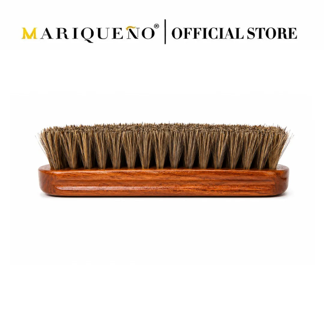 Wooden brush with bristles on a white background, branded as Mariqueno Official Store.