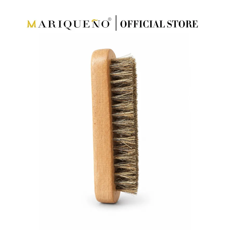 Wooden brush with bristles on a white background, branded as Mariqueno Official Store.